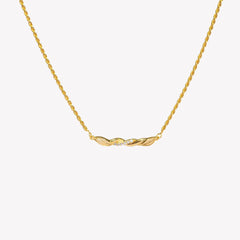 Sacred Vine Necklace in 18k gold-plated features an intertwined bar pendant on a delicate 1.6mm rope chain by Rizen Jewelry. 