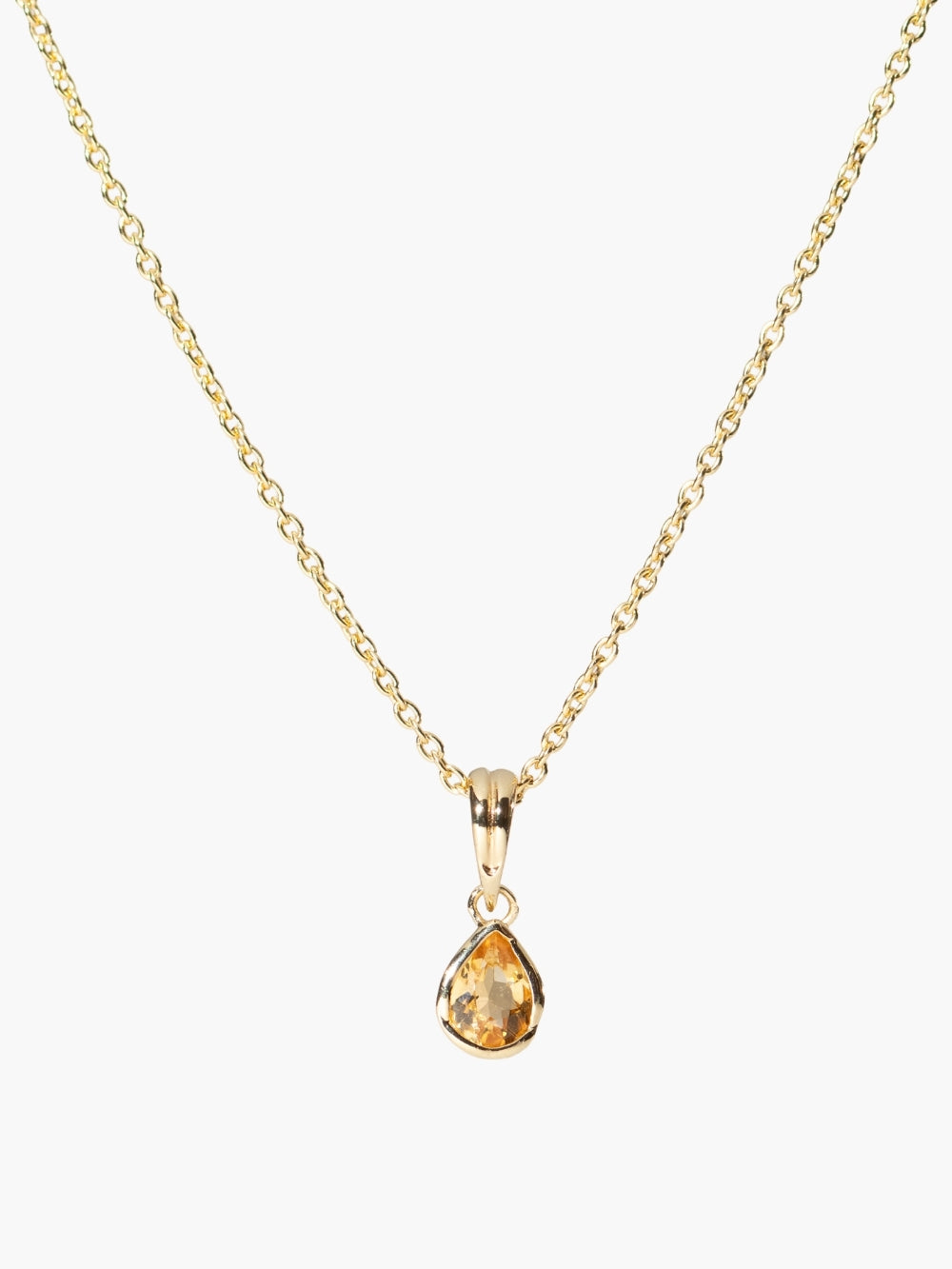  A pear-cut light citrine stone is cradled in a 18k gold finished setting. The pendant symbolizes wisdom, truth, guidance, and the month of November by Rizen Jewelry featured on a cable chain. 