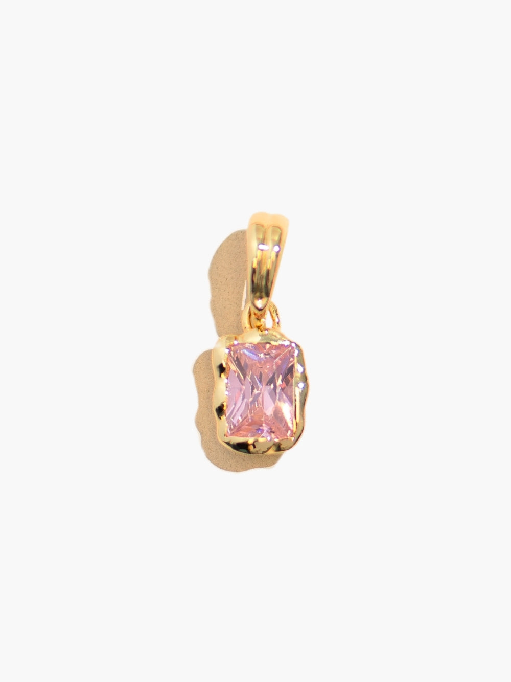 Close-up of light pink fully known prayer pendant by Rizen Jewelry in 18 karat gold 