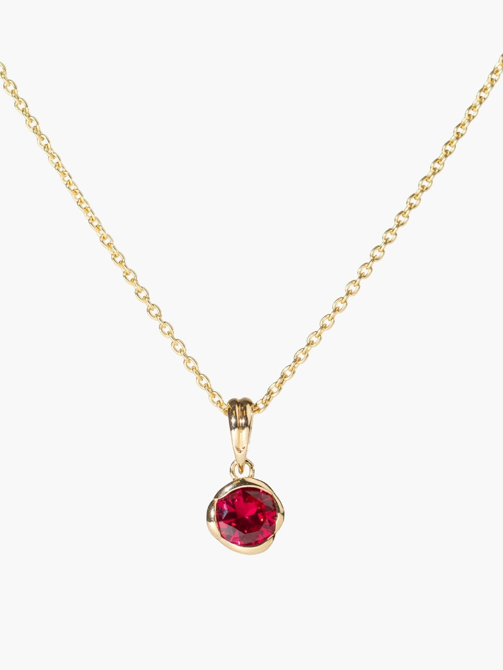 Ruby Fully Known Prayer Pendant by Rizen Jewelry features a round brilliant-cut light lab ruby stone is cradled in 18k gold plating over sterling silver setting. The pendant symbolizes passion, redemption, value, and the month of July. Featured on a sleek cable chain. 