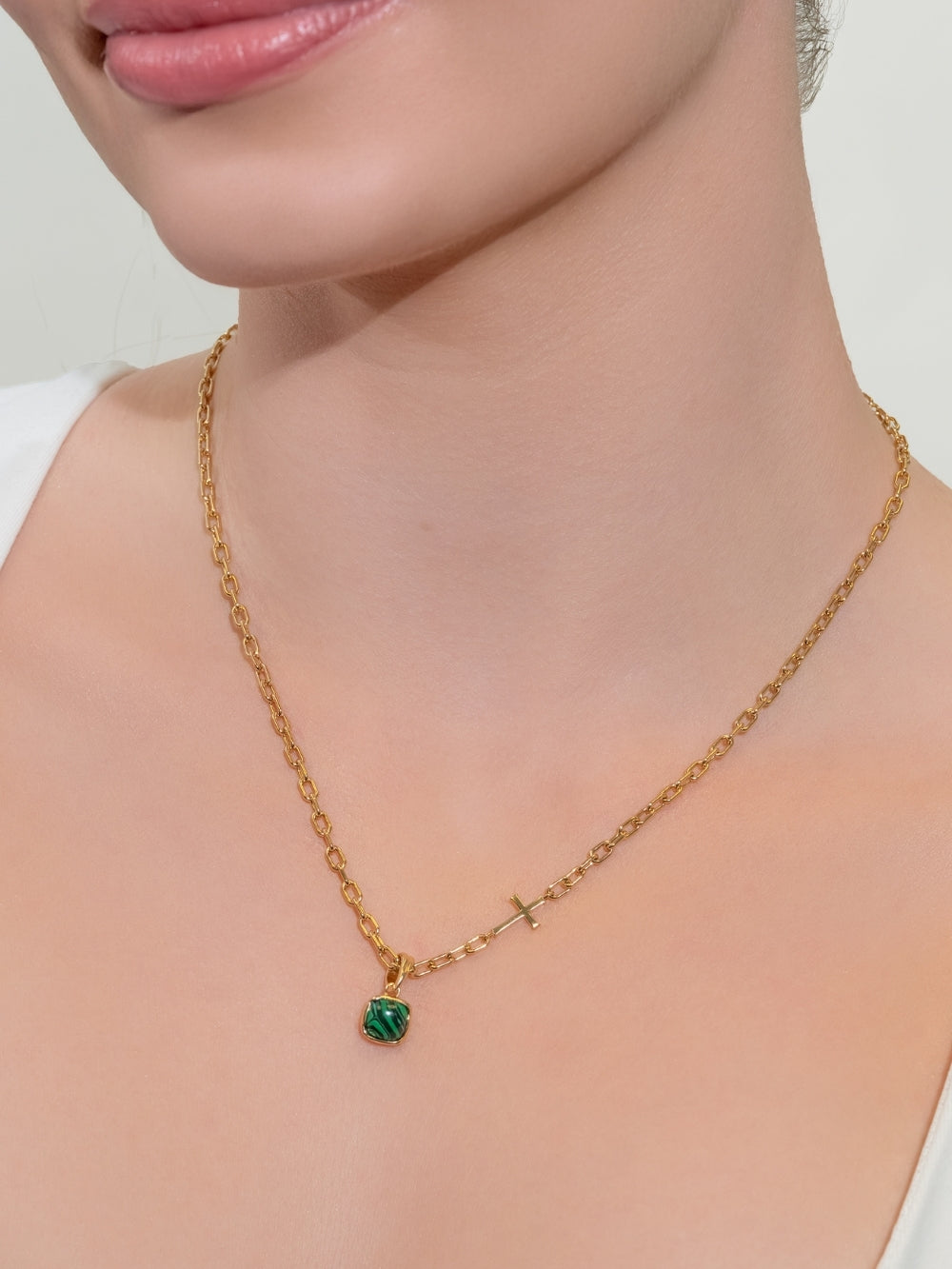 Malachite Fully Known Prayer Pendant featured on the mini chain breaker cross necklace worn by a women's Christian jewelry model.
