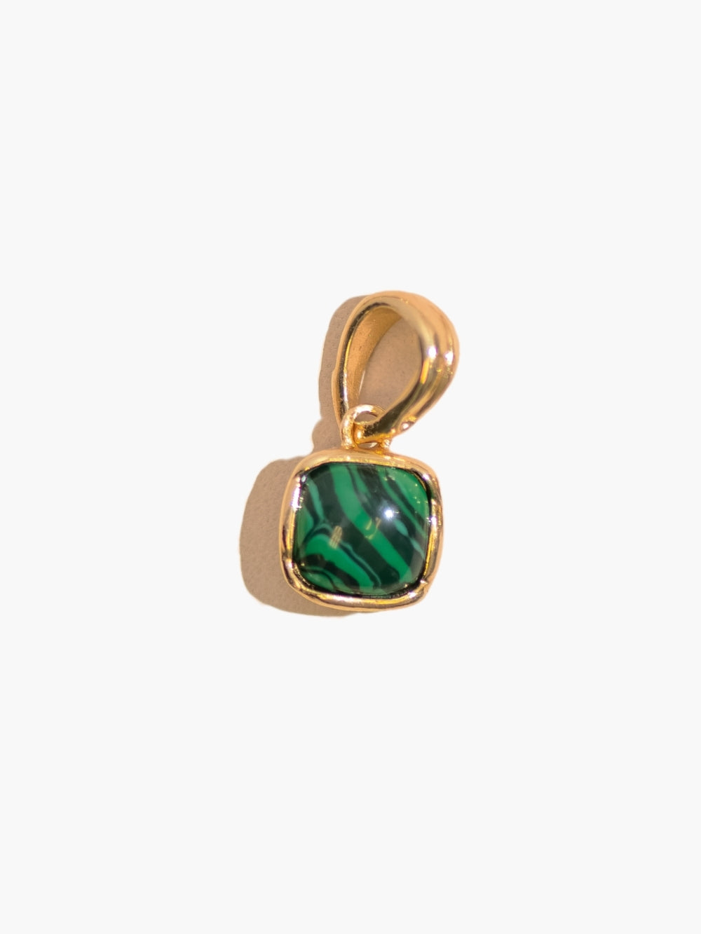 Close-up of the Malachite Fully Known Prayer Pendant by Rizen Jewelry features a distinctive square cabochon cut malachite pendant, reflecting intentionality, growth, and the stone for May, cradled gently in refined 18k gold plating over sterling silver. 