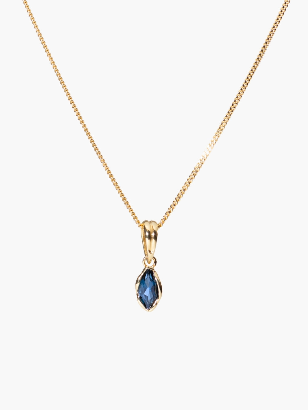 London blue topaz fully known prayer pendant featured on gold curb chain by Rizen Jewelry.