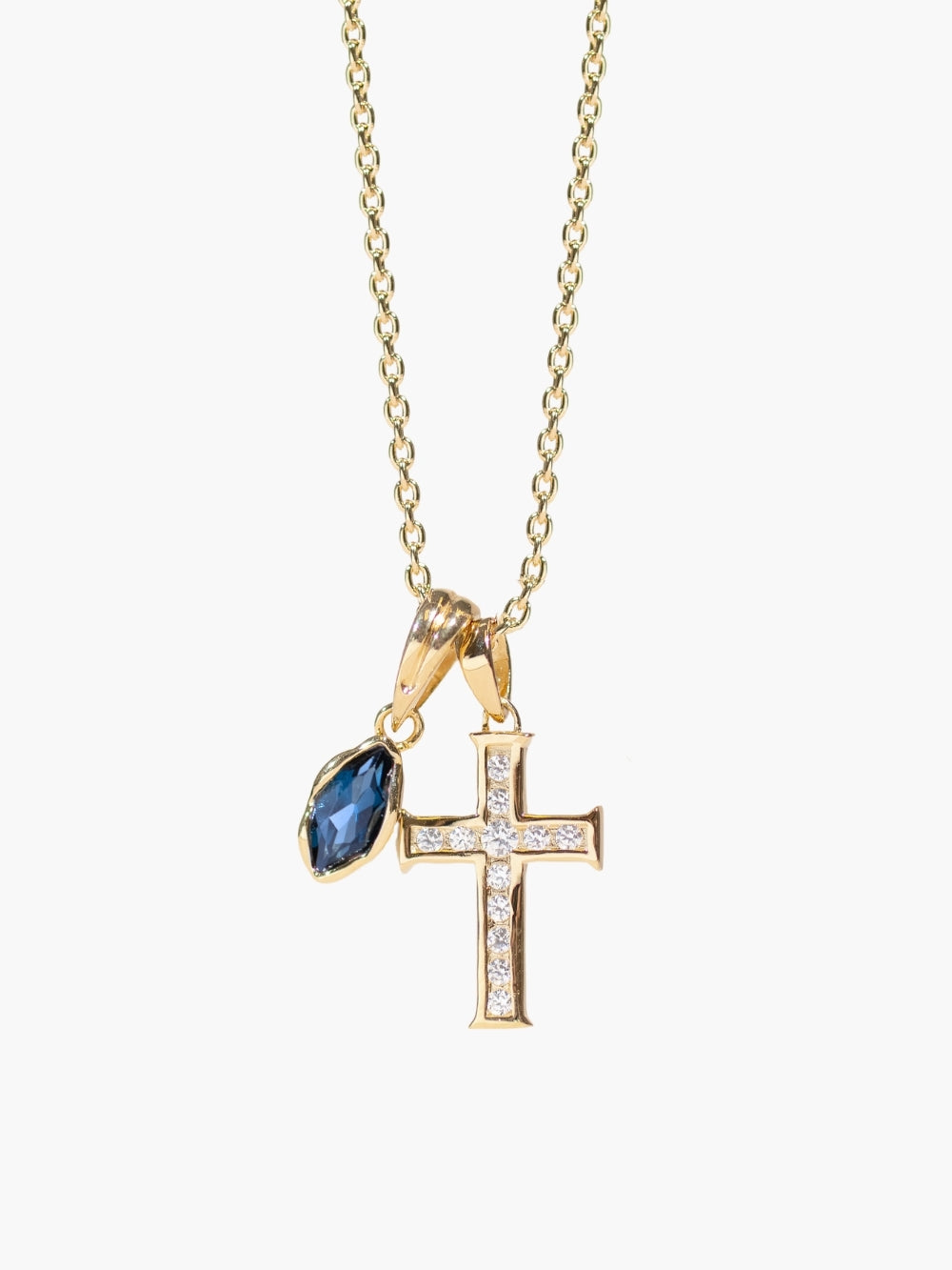 London Blue Topaz fully known pear pendant layered on the luminous cross pendant necklace by Rizen Jewelry 