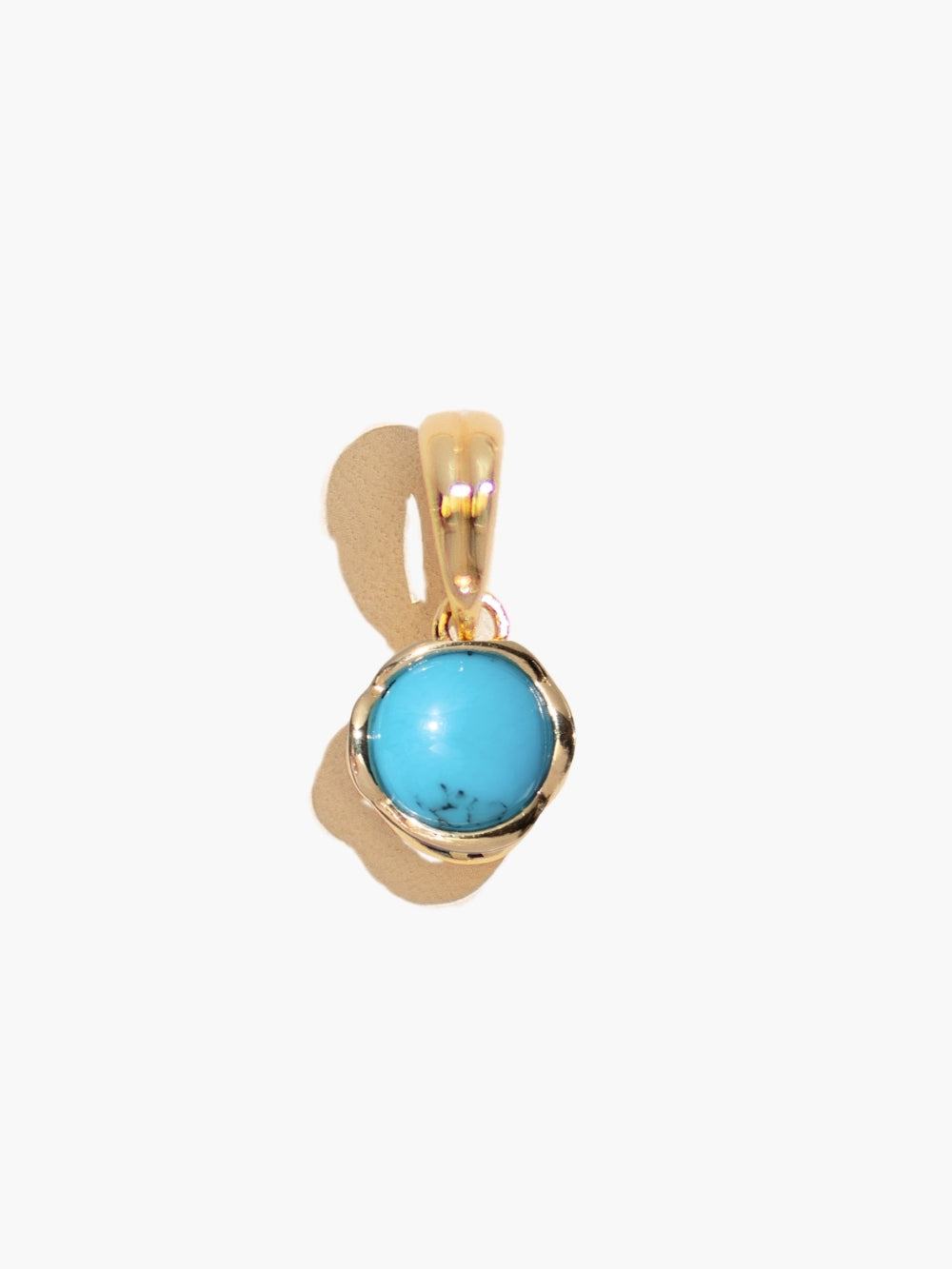 Close up of Turquoise Fully Known Prayer Pendant by Rizen Jewelry features a round cabochon turquoise stone is cradled in 18k gold plating over sterling silver setting. The pendant symbolizes Restoration, Leadership, Favor, and the month of December.