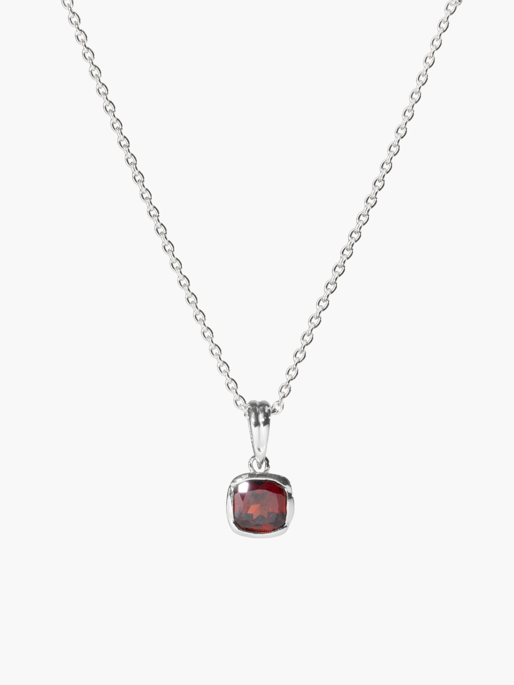 Garnet fully known prayer pendant shown on a sterling silver cable chain.