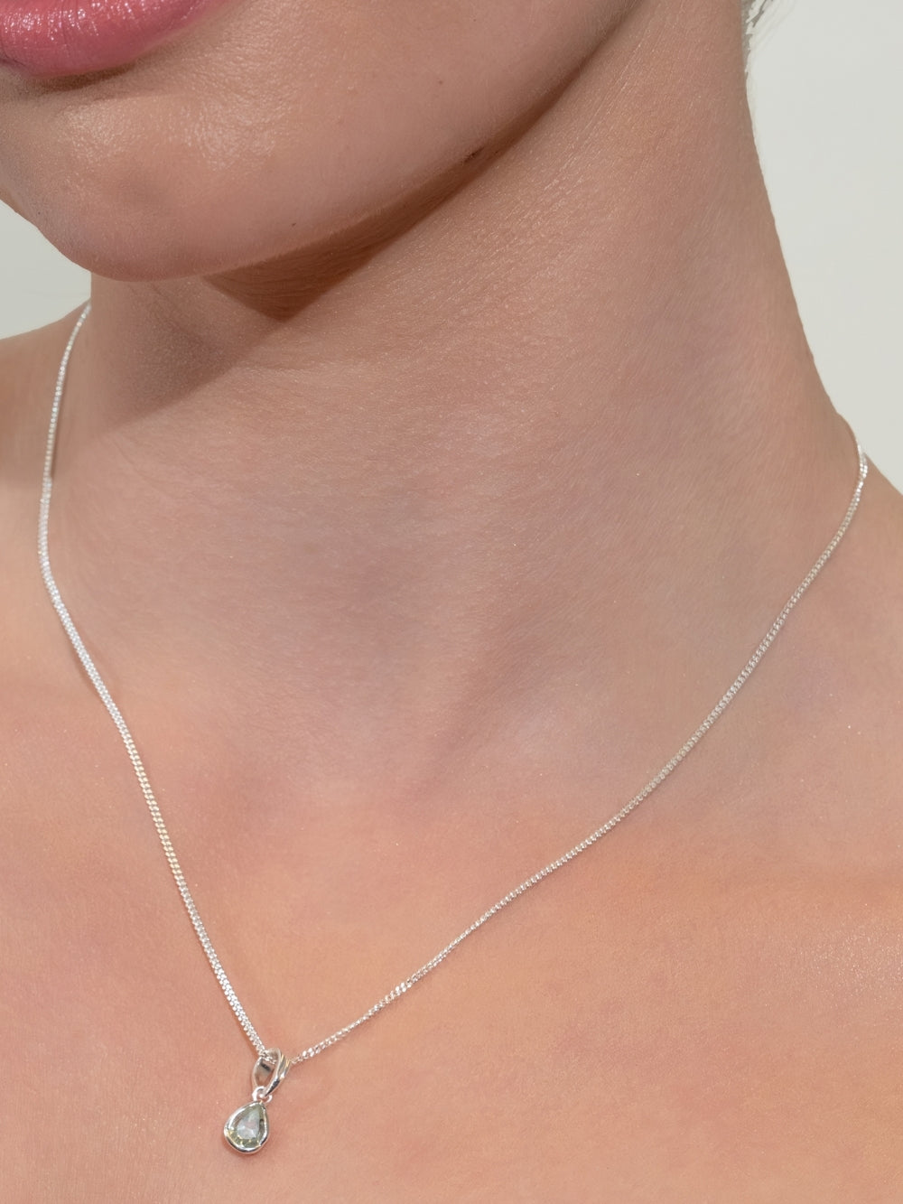 Rizen Jewelry Green Quartz Fully Known Prayer Pendant in Sterling Silver on a women's Christian jewelry model. 