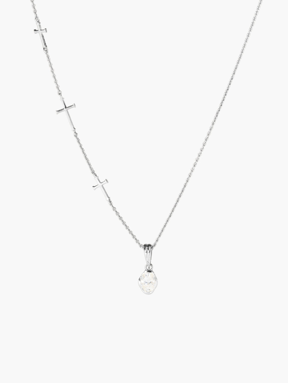 White Sapphire Fully Known Prayer Pendant by Rizen Jewelry features An oval brilliant cut white sapphire stone is cradled in 18k gold plating over sterling silver setting. The pendant symbolizes Purity, New Identity, Innocence, and the month of April. Shown featured on the Calvary three cross necklace.