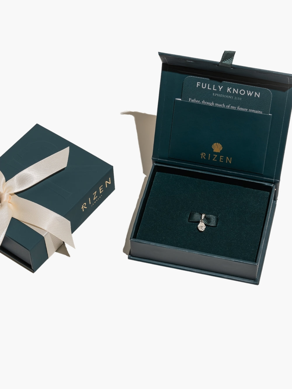Packaged as a beautiful gift featuring the White Sapphire Fully Known Prayer Pendant by Rizen Jewelry features An oval brilliant cut white sapphire stone is cradled in 18k gold plating over sterling silver setting. The pendant symbolizes Purity, New Identity, Innocence, and the month of April.
