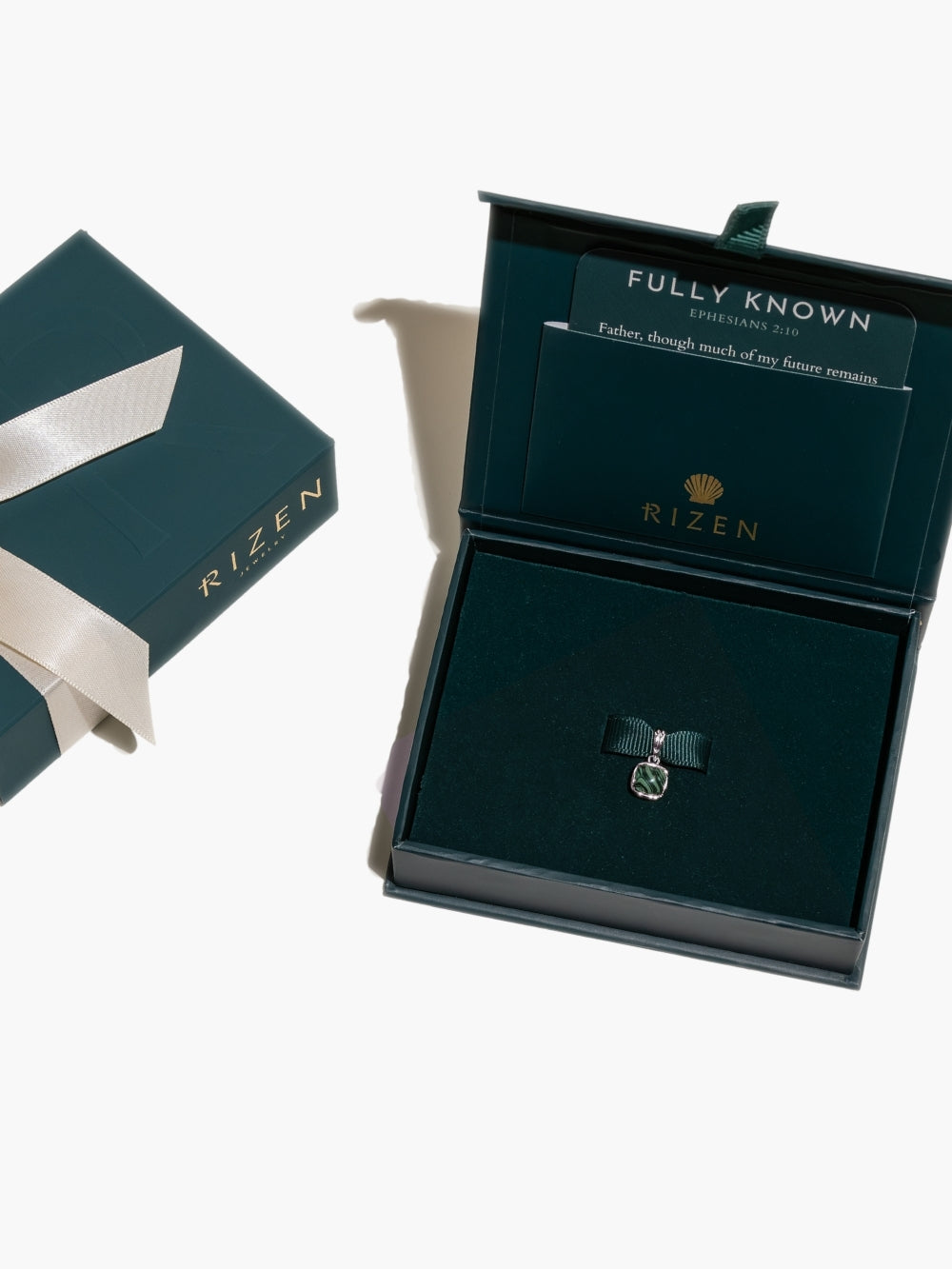 The Malachite Fully Known Prayer Pendant is ready to be gifted in the signature Rizen packaging. 