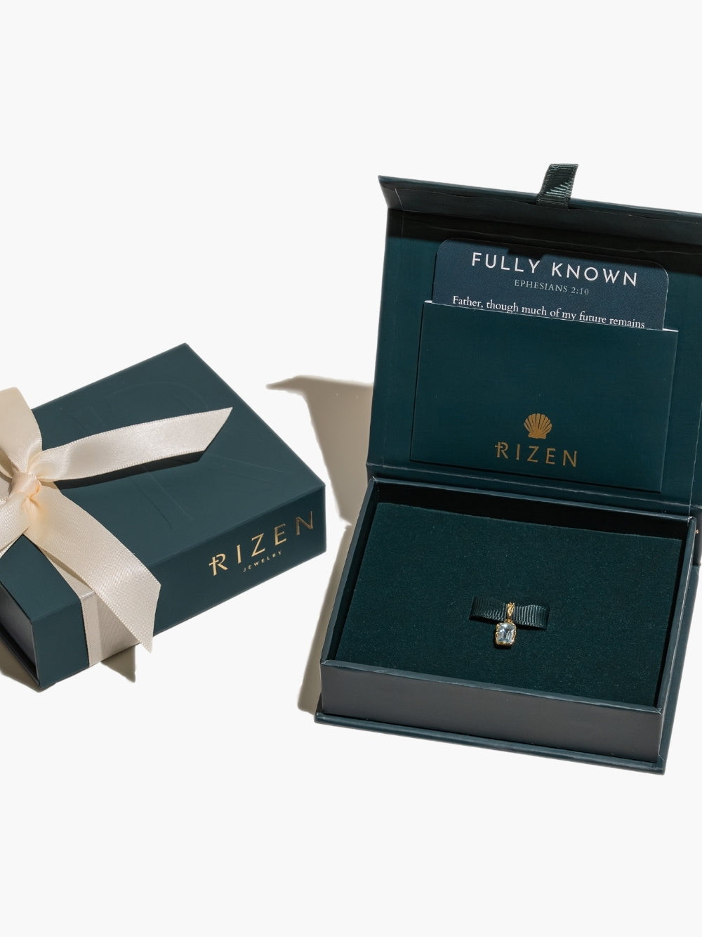 Sky Blue Topaz fully known prayer pendant featured in the gift box packaging from Rizen Jewelry 