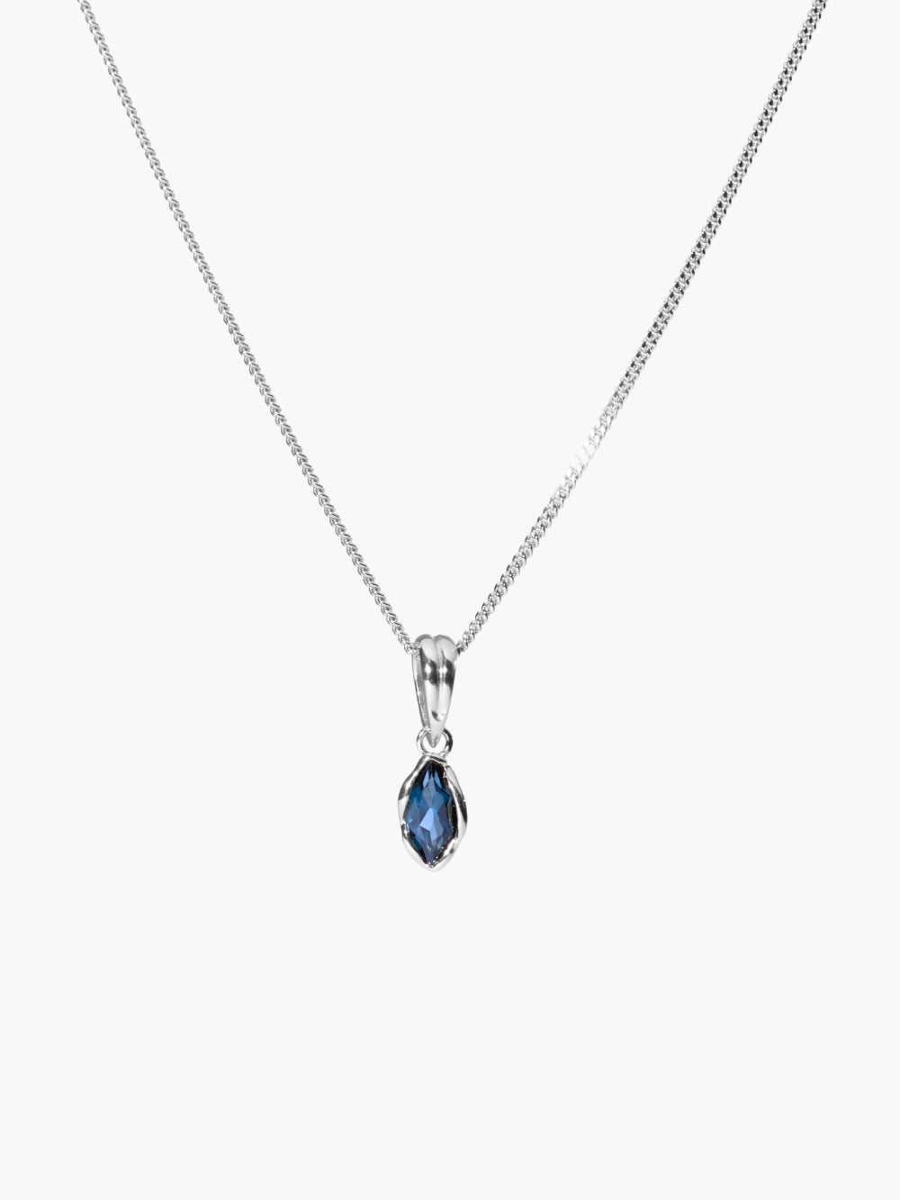 London Blue Topaz fully known prayer pendant featured on a sleek curb chain by Rizen Jewelry. 
