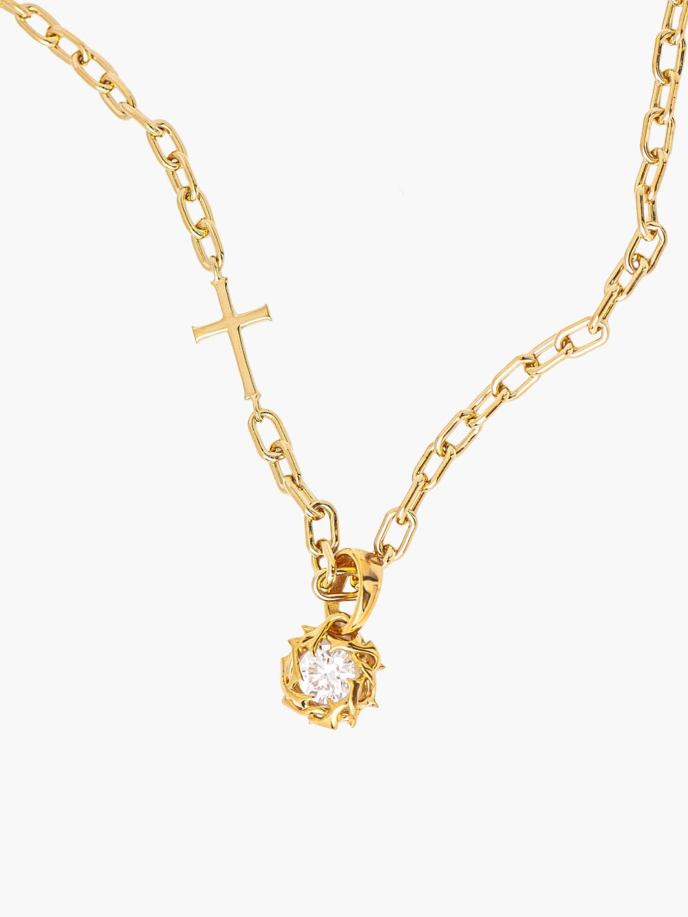 Rizen Jewelry Crown of Thorns pendant in 18-karat gold finish. The Crown of Thorns intricately nestles a round brilliant cut cubic zirconia in the center. Featured on the mini chain breaker cross necklace. 