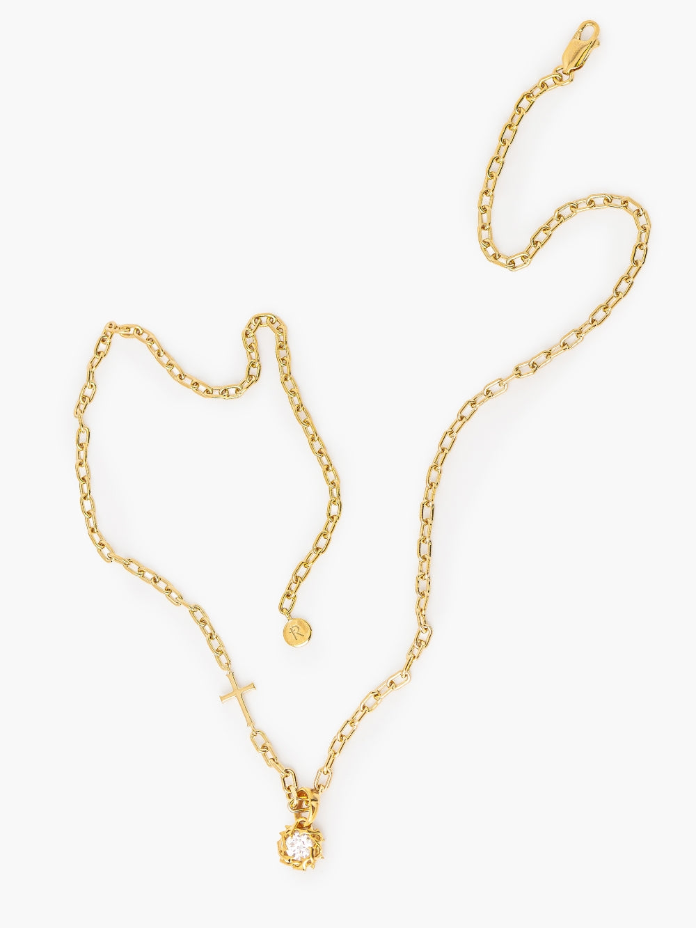 Rizen Jewelry Crown of Thorns pendant in 18-karat gold finish. The Crown of Thorns intricately nestles a round brilliant cut cubic zirconia in the center. Featured on the mini chain breaker cross necklace in gold.