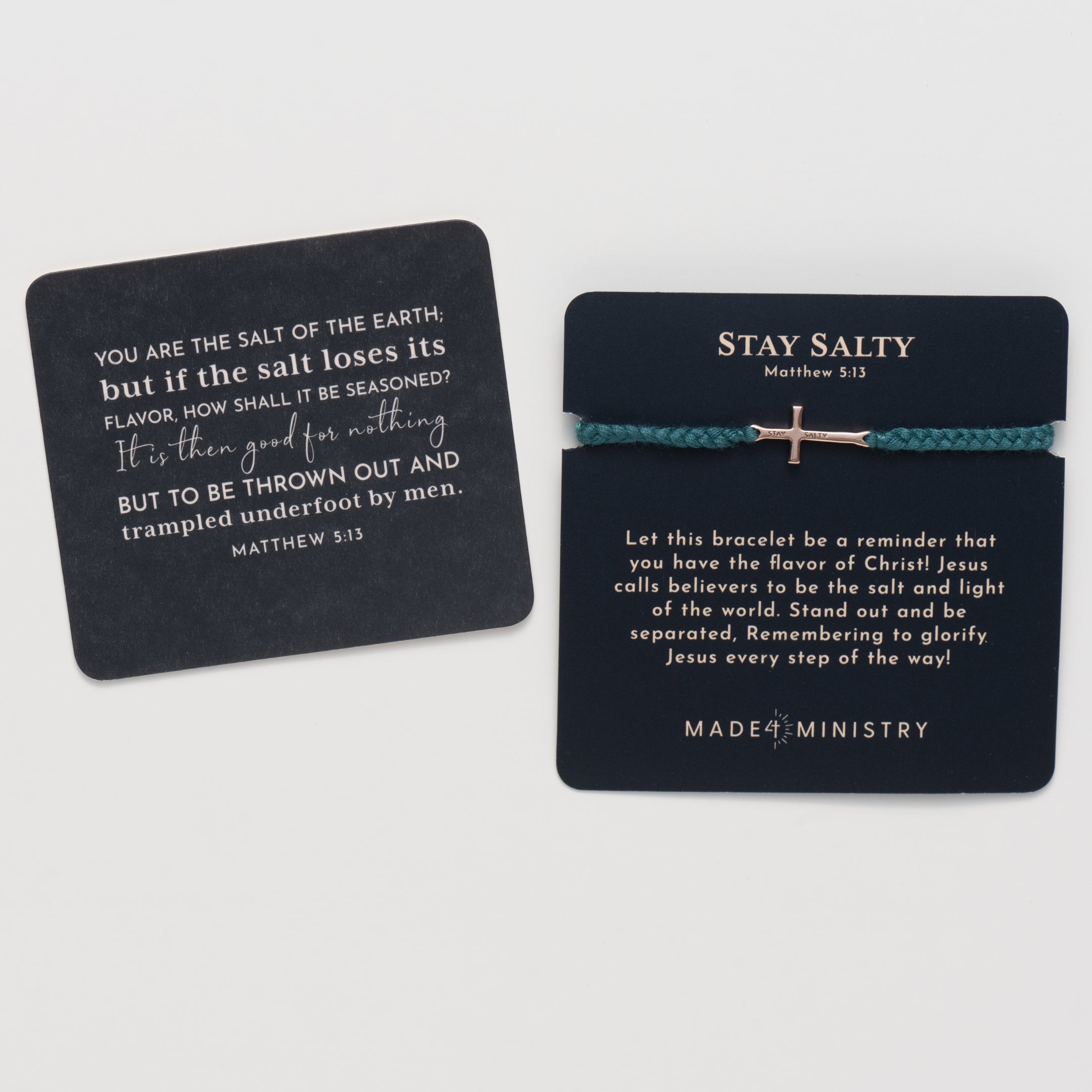 Cross bracelet engraved STAY SALTY set on a naturally dyed azure blue hand-braided, cotton cord friendship bracelet with a  rose gold finish from the Made4Ministry Collection by Rizen Jewelry. Featured on a devotion card next to the mini scripture card. 