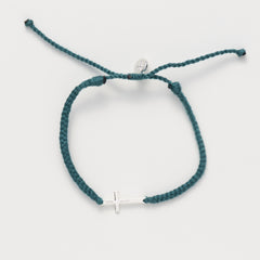 Cross bracelet engraved STAY SALTY set on a naturally dyed azure blue hand-braided, cotton cord friendship bracelet with a  Sterling Silver finish from the Made4Ministry Collection by Rizen Jewelry. 