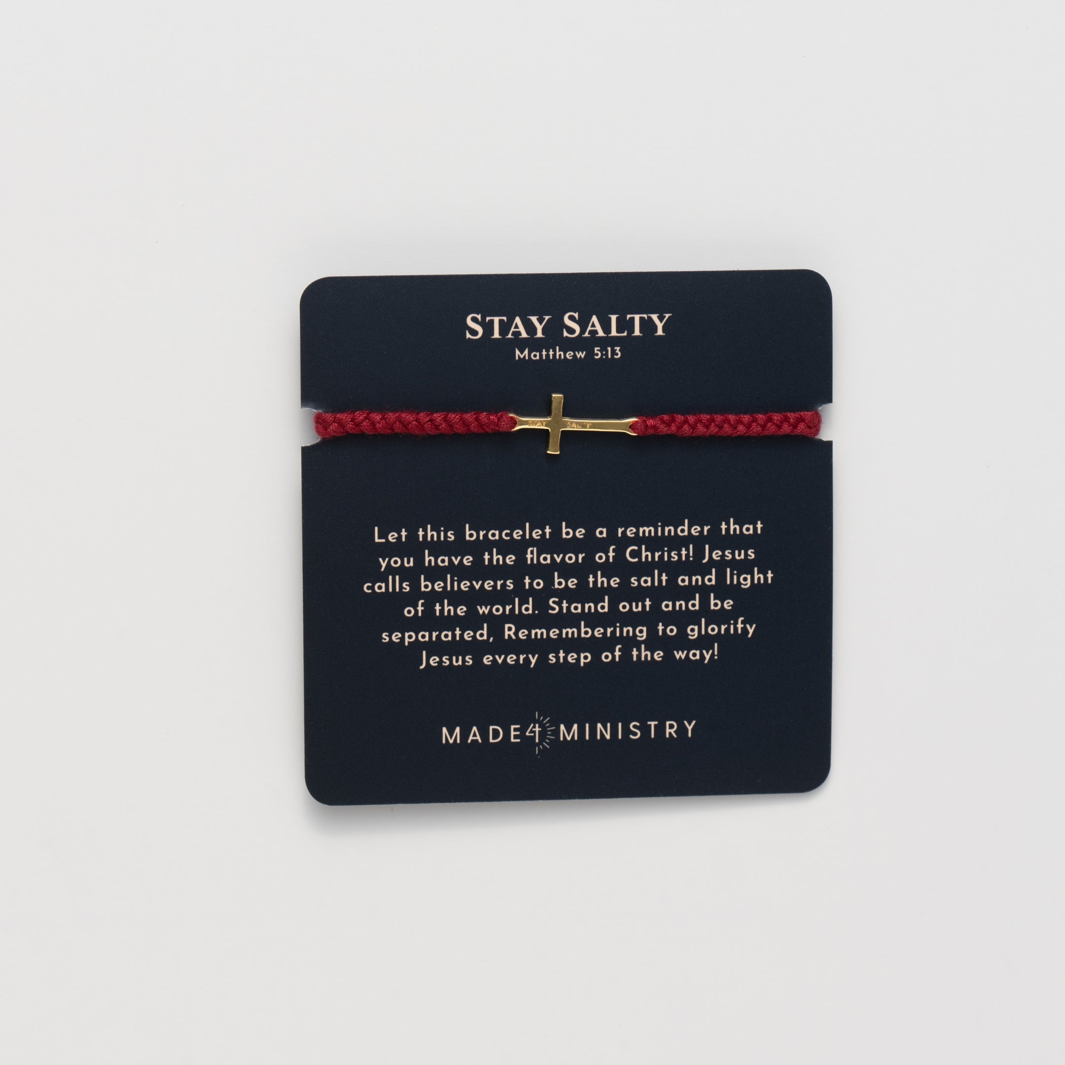 Christian gold cross bracelet engraved "STAY SALTY" hand braided garnet red cotton cords by Rizen Jewelry Made 4 Ministries collection. Featured on a Devotion Card. 