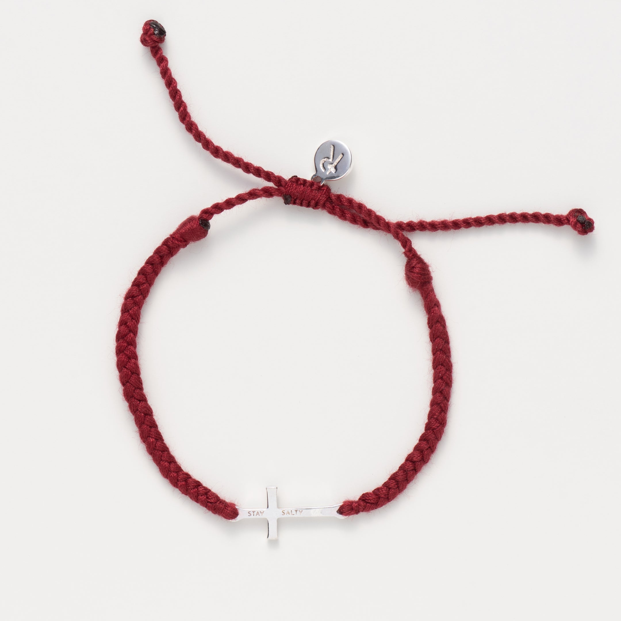  Christian silver cross friendship bracelet engraved "STAY SALTY" hand braided garnet red cotton cords by Rizen Jewelry Made 4 Ministries collection.