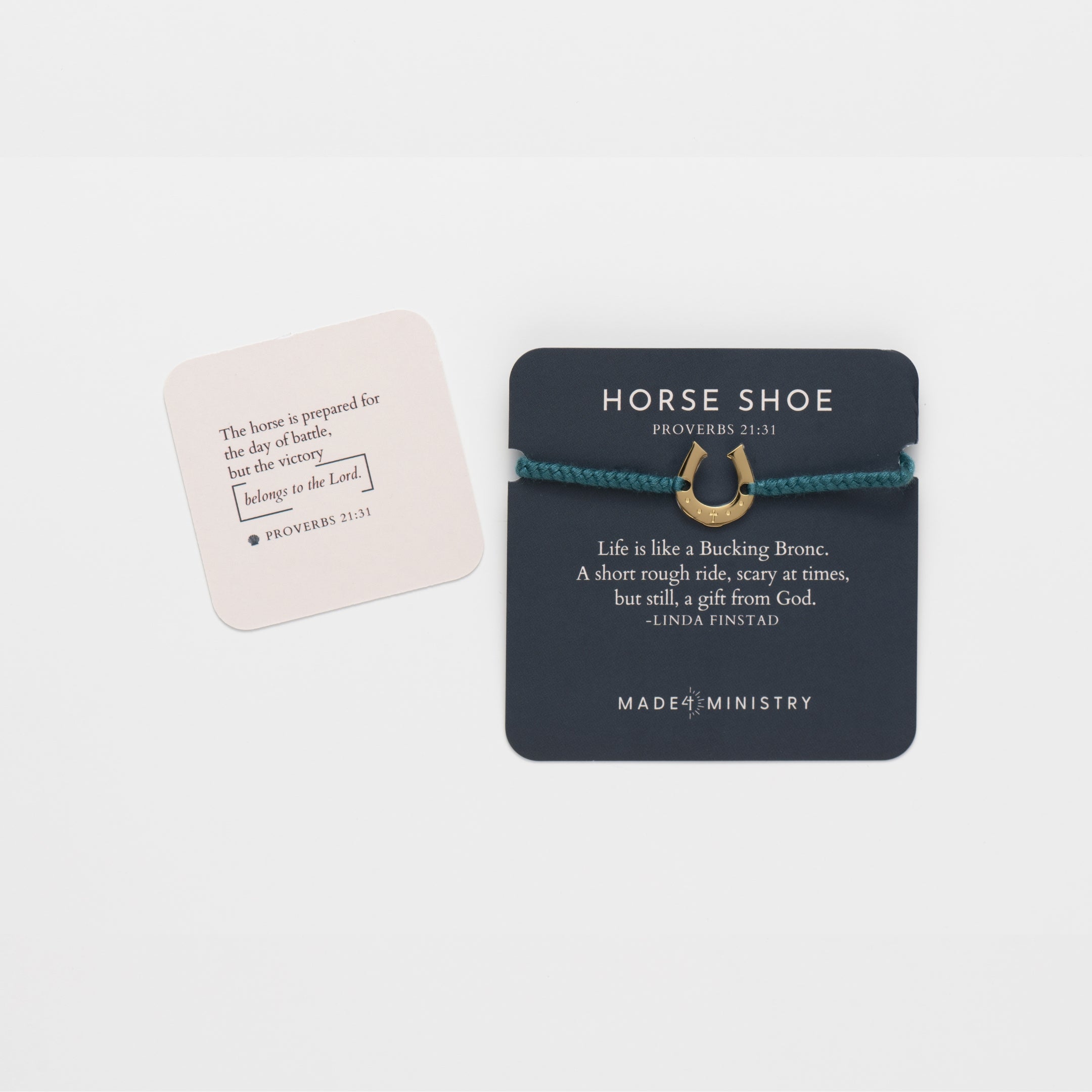 Horseshoe bracelet engraved with a cross set on a naturally dyed azure blue hand-braided, cotton cord friendship bracelet. Available in 18k Gold and Sterling Silver finish. Featured on a Devotion card with a mini scripture card from the Made4Ministry Collection by Rizen Jewelry.