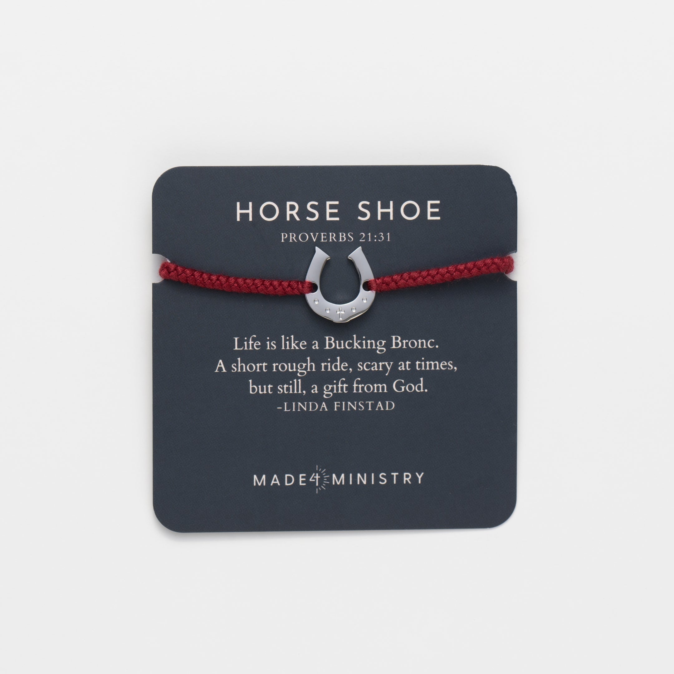 Horseshoe bracelet engraved with a cross set on a naturally dyed garnet red hand-braided, cotton cord friendship bracelet. Available in 18k Gold and Sterling Silver finish. Designed by Rizen Jewelry for the Made4Ministry Collection. Featured on a Devotion Card.