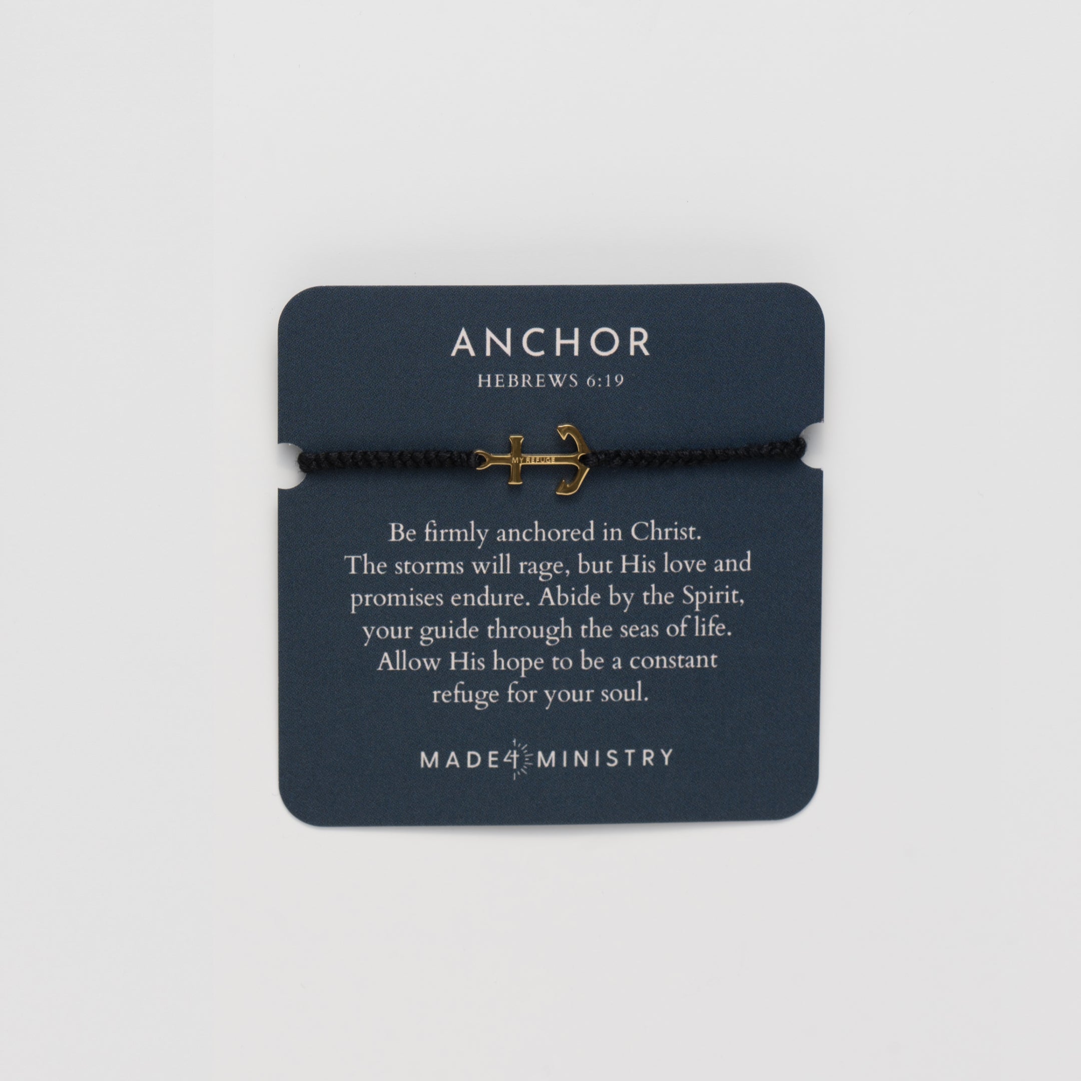 Inspirational devotion card featuring the classic nautical anchor bracelet, delicately engraved with the inscription “MY REFUGE,” hand-braided from naturally dyed black cotton cord. Available in 18k gold or sterling silver finish from the Made4Ministry Collection by Rizen Jewelry. 