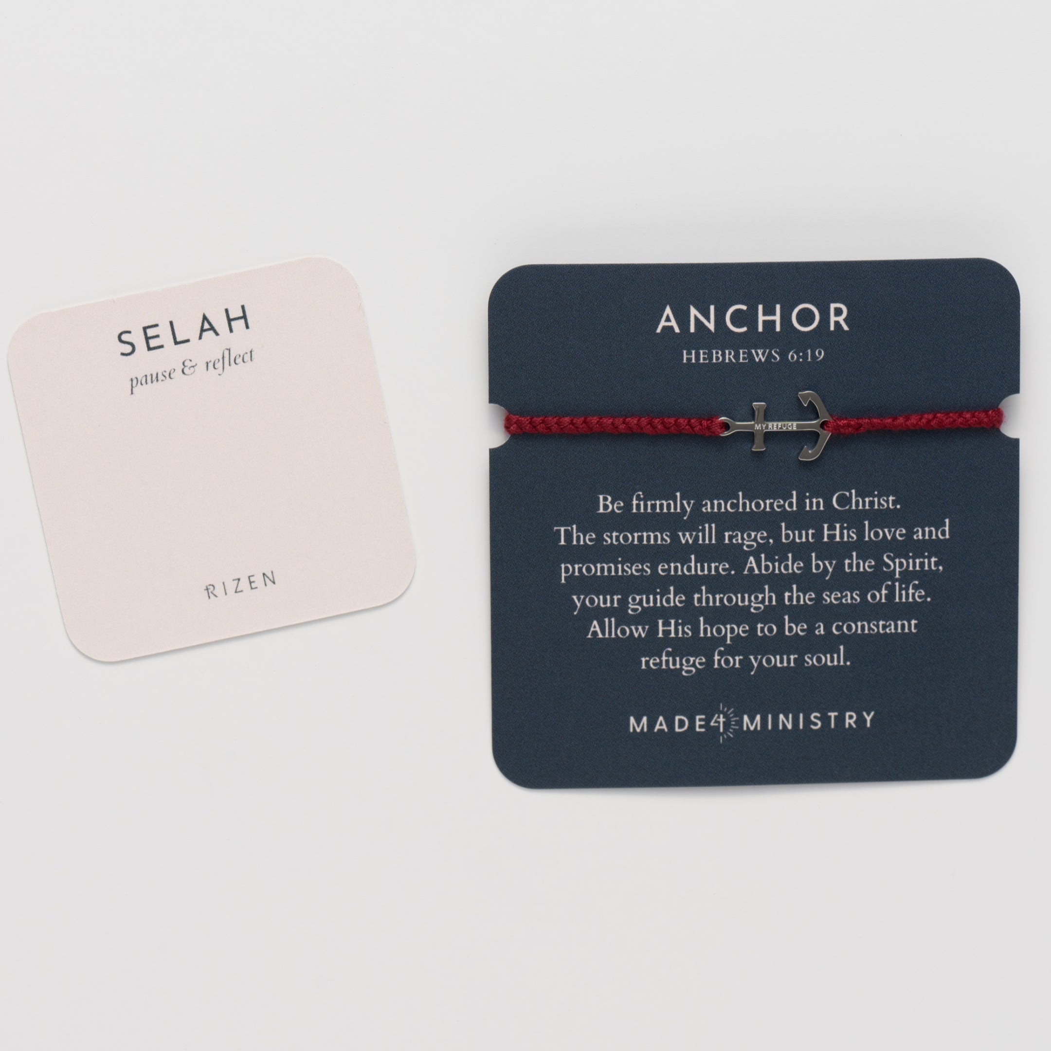 Inspirational devotion card with matching prayer card features the classic nautical anchor bracelet, delicately engraved with the inscription “MY REFUGE,” hand-braided from naturally dyed garnet red cotton cord. Available in 18k gold or sterling silver finish from the Made4Ministry Collection by Rizen Jewelry. 