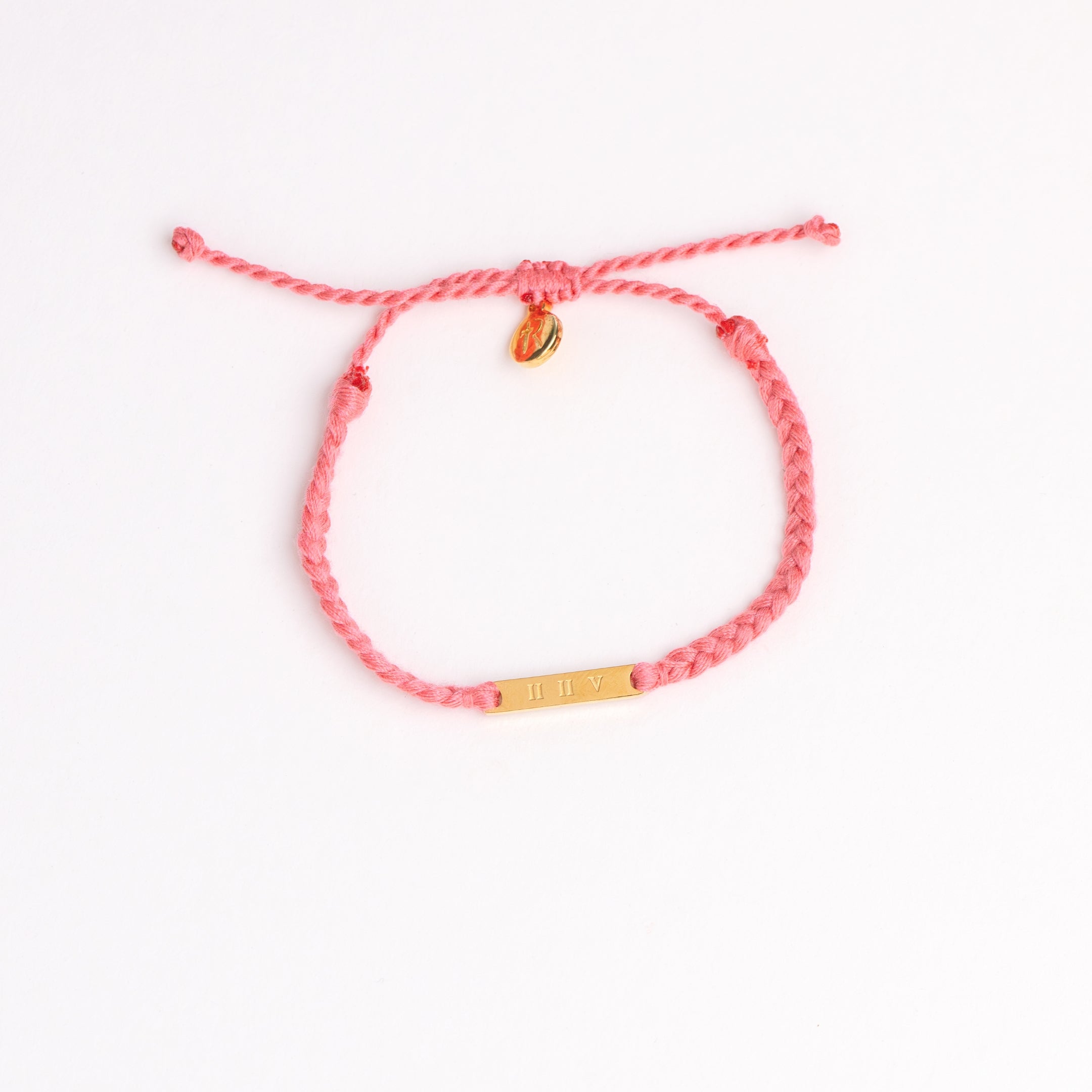 Restore Made4Ministry pink dusty rose cord bracelet x Britt Nicole from her new album IIV featuring the verse Joel 2:25. The gold bar pendant is engraved IIV on the back. 