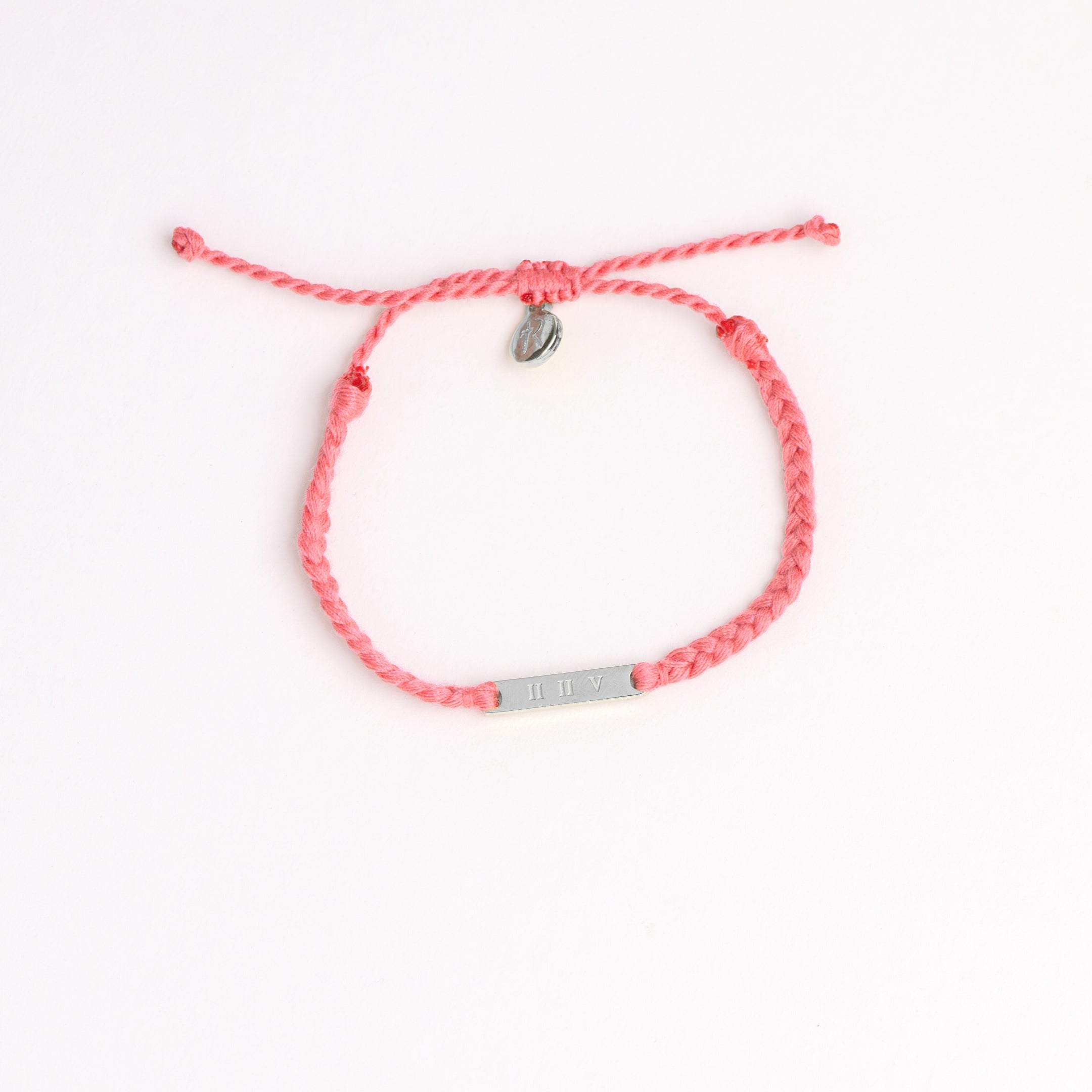 Restore Made4Ministry pink dusty rose cord bracelet x Britt Nicole from her new album IIV featuring the verse Joel 2:25. The silver bar pendant is engraved IIV on the back. 