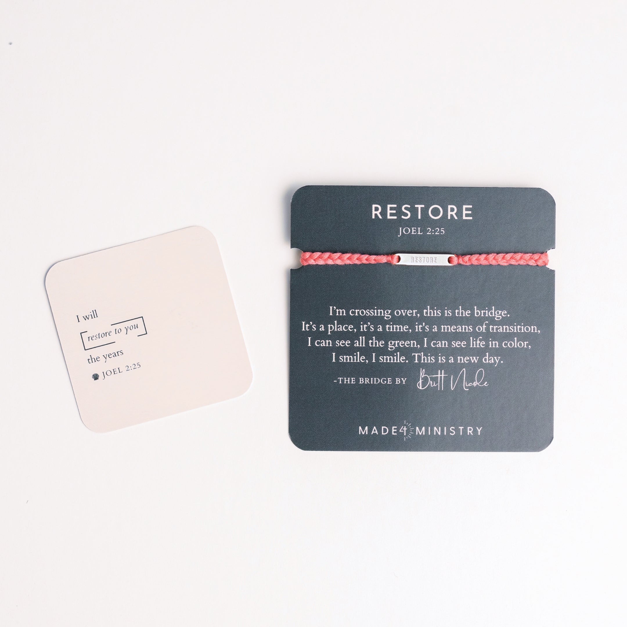 Restore Made4Ministry pink dusty rose cord bracelet x Britt Nicole from her new album IIV featuring the verse Joel 2:25. The silver bar pendant is engraved RESTORE on the front and IIV on the back. 
