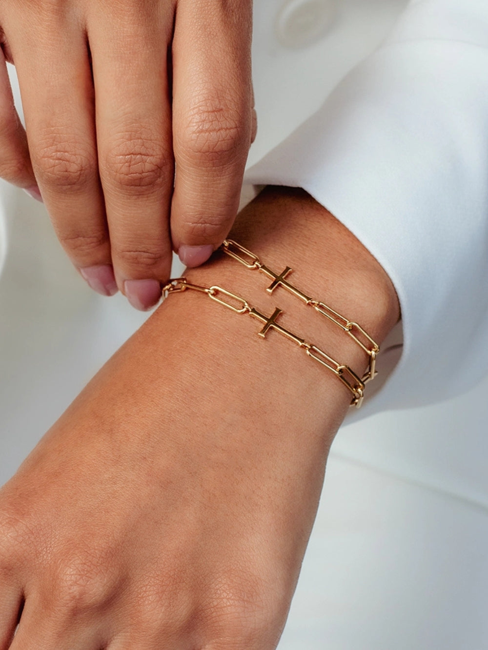 Two Chain breaker cross bracelet in 18k gold plated from the Calvary collection.  A timeless baptism gift by Rizen Jewelry.