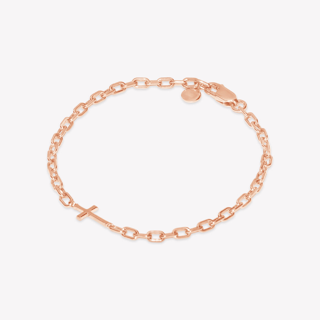 Mini Chain Breaker Cross Bracelet in 18k rose gold plated from the Calvary collection. Inspirational Faith Jewelry for Women by Rizen Jewelry.

