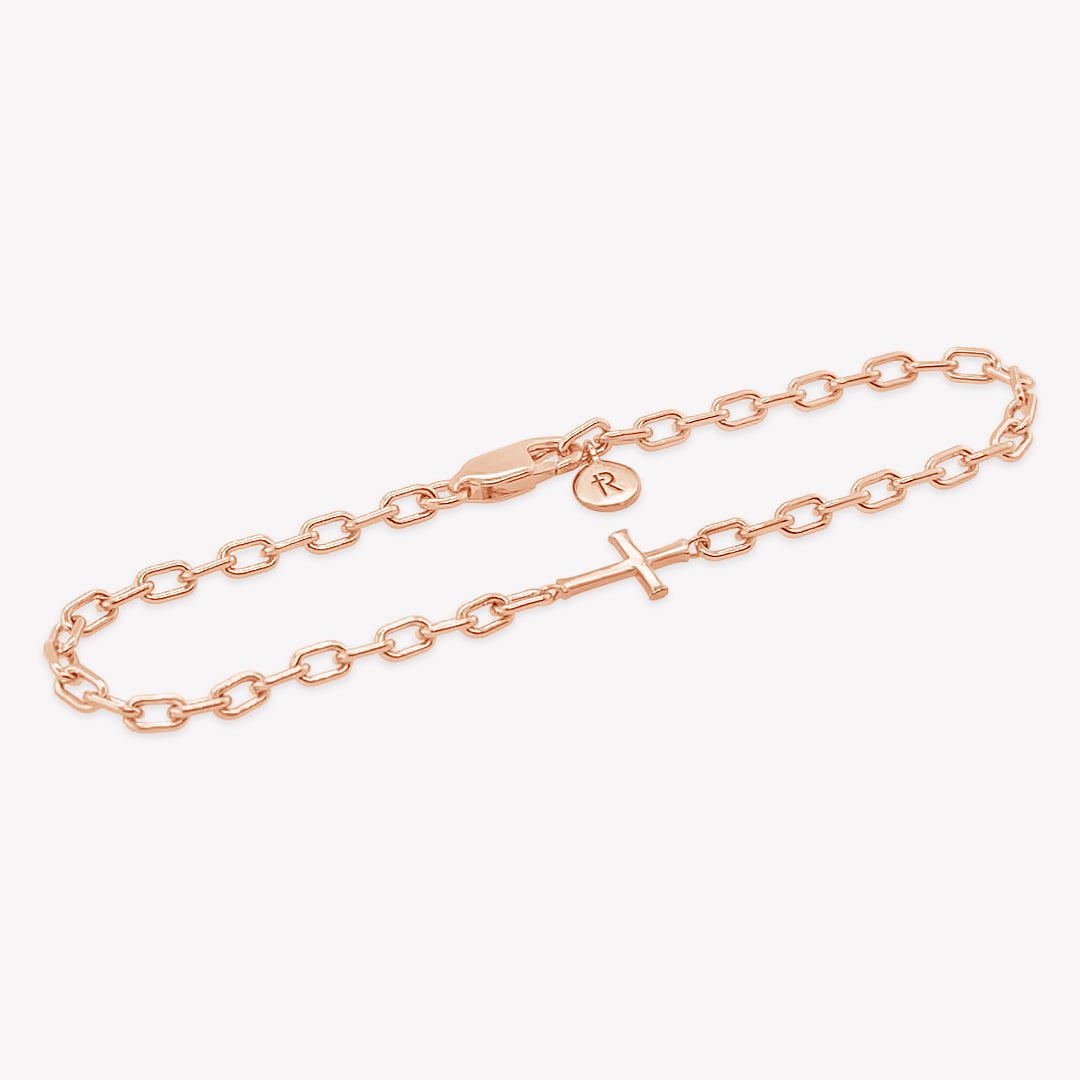 Mini Chain Breaker Cross Bracelet in 18k rose gold plated from the Calvary collection. Inspirational Faith Jewelry for Women by Rizen Jewelry.