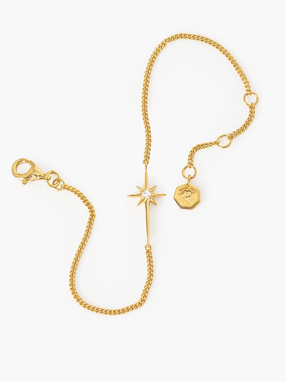 Polished curb chain and adjustable length details of the Adoring Star Bracelet by Rizen Jewelry.