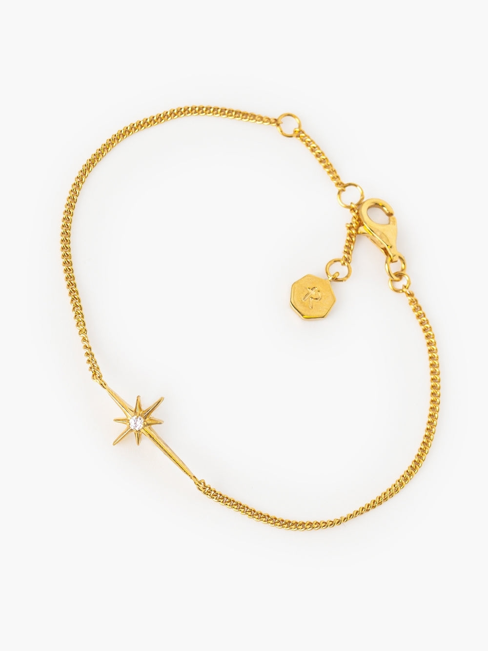 Adoring Star Bracelet with star-cross charm and cubic zirconia on gold curb chain, from the insignia collection designed by Rizen Jewelry.
