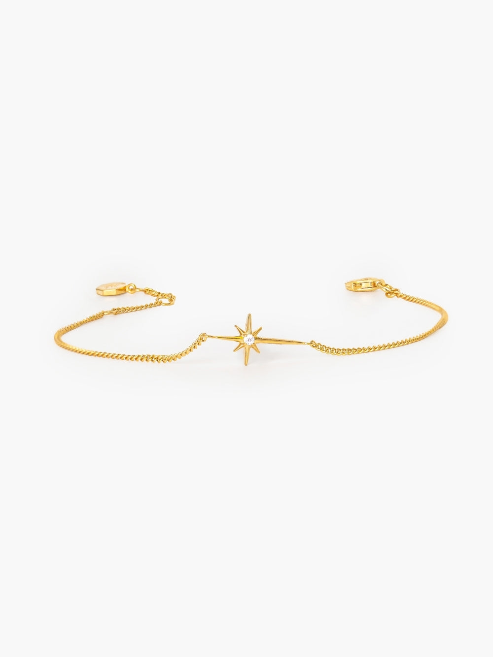 Adoring Star Bracelet with star-cross charm and cubic zirconia on gold curb chain, from the insignia collection designed by Rizen Jewelry.