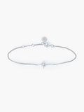 Adoring Star Bracelet with star-cross charm and cubic zirconia on silver curb chain, designed by Rizen Jewelry.
