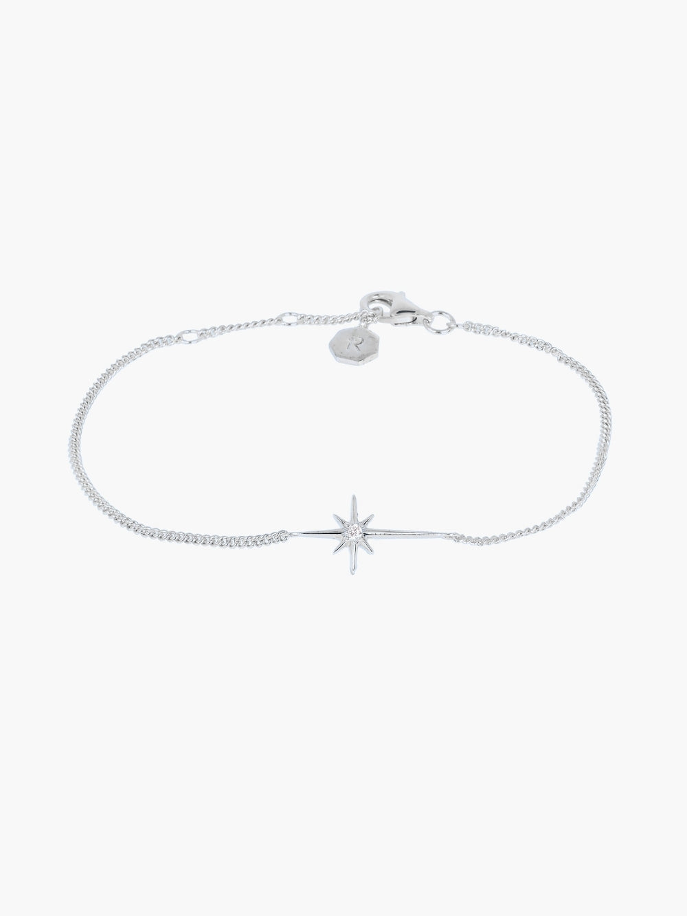 Adoring Star Bracelet with star-cross charm and cubic zirconia on silver curb chain, designed by Rizen Jewelry.