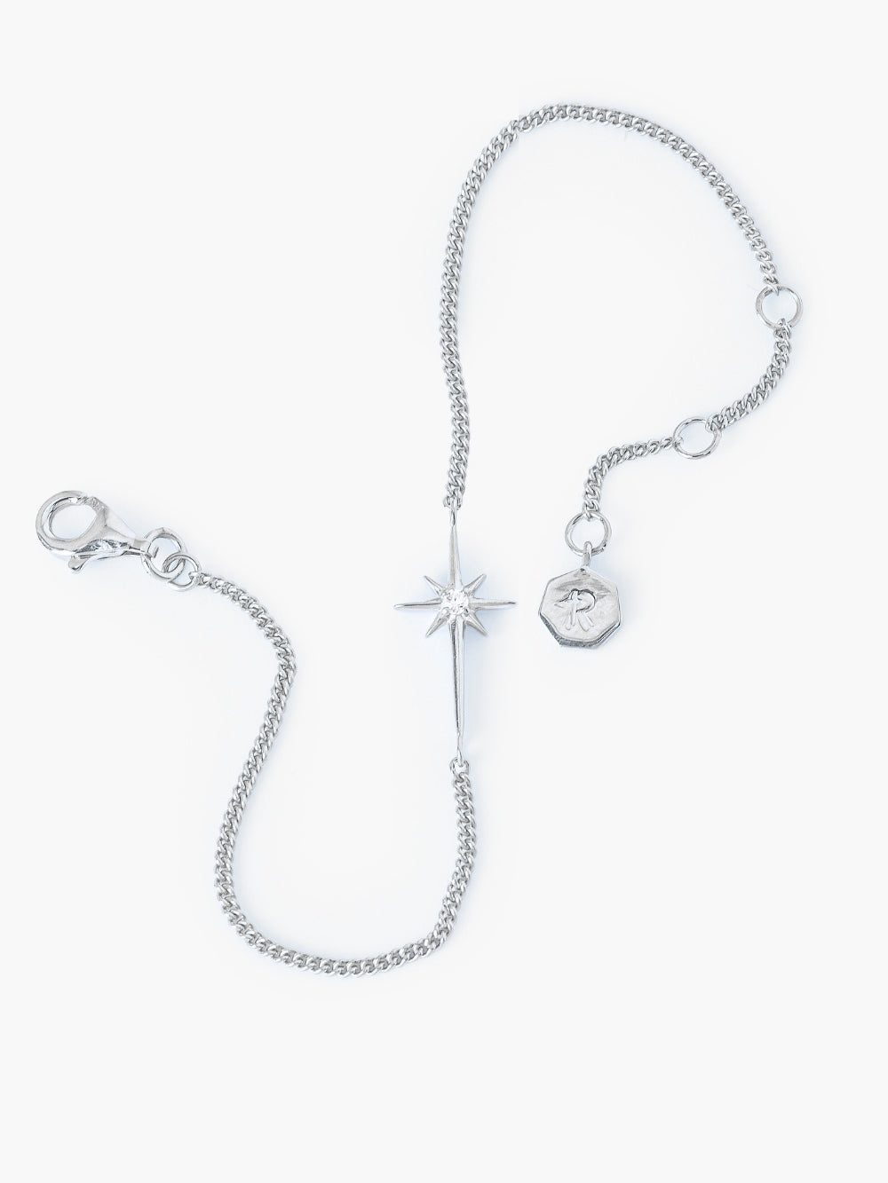 Adoring Star Bracelet with star-cross charm and showcasing the 3 different lengths andsleek silver curb chain details, designed by Rizen Jewelry.