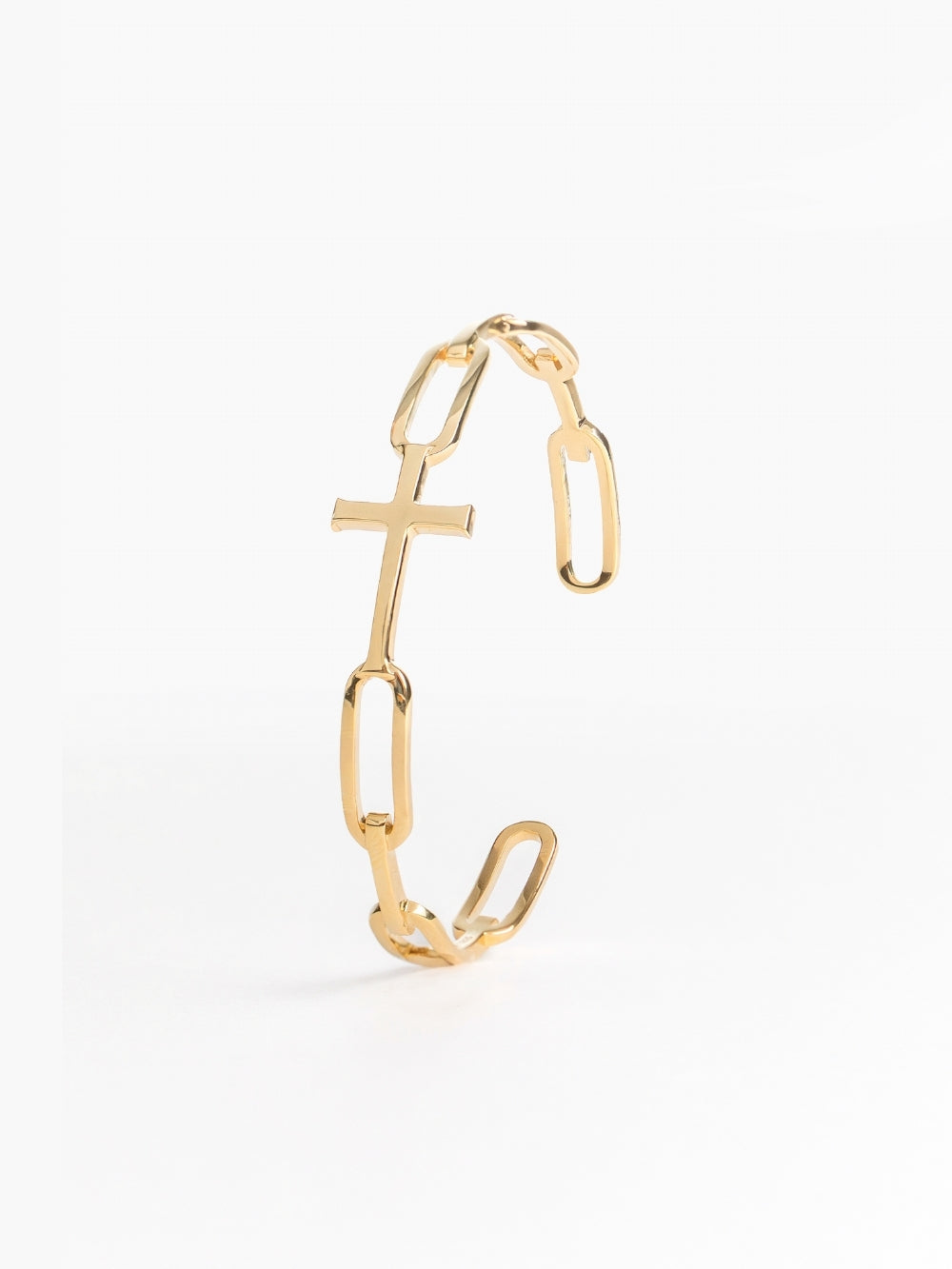 Bold yet sleek cross cuff bangle featuring striking links seamlessly transitioning into the classic Rizen Cross in heavy 18k gold plating. 