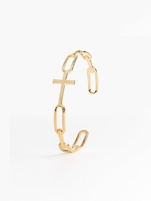Bold yet sleek cross cuff bangle featuring striking links seamlessly transitioning into the classic Rizen Cross in heavy 18k gold plating. 