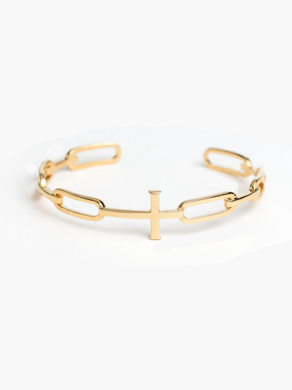 Bold yet sleek cross cuff bangle featuring striking links seamlessly transitioning into the classic Rizen Cross in heavy 18k gold plating. 