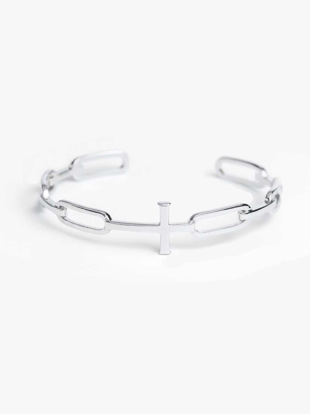 Chain Breaker Cross Cuff Bagle Bracelet is a Sterling silver bold yet sleek cuff bangle that beautifully expresses one’s faith, featuring striking links seamlessly transitioning into the classic Rizen Cross.