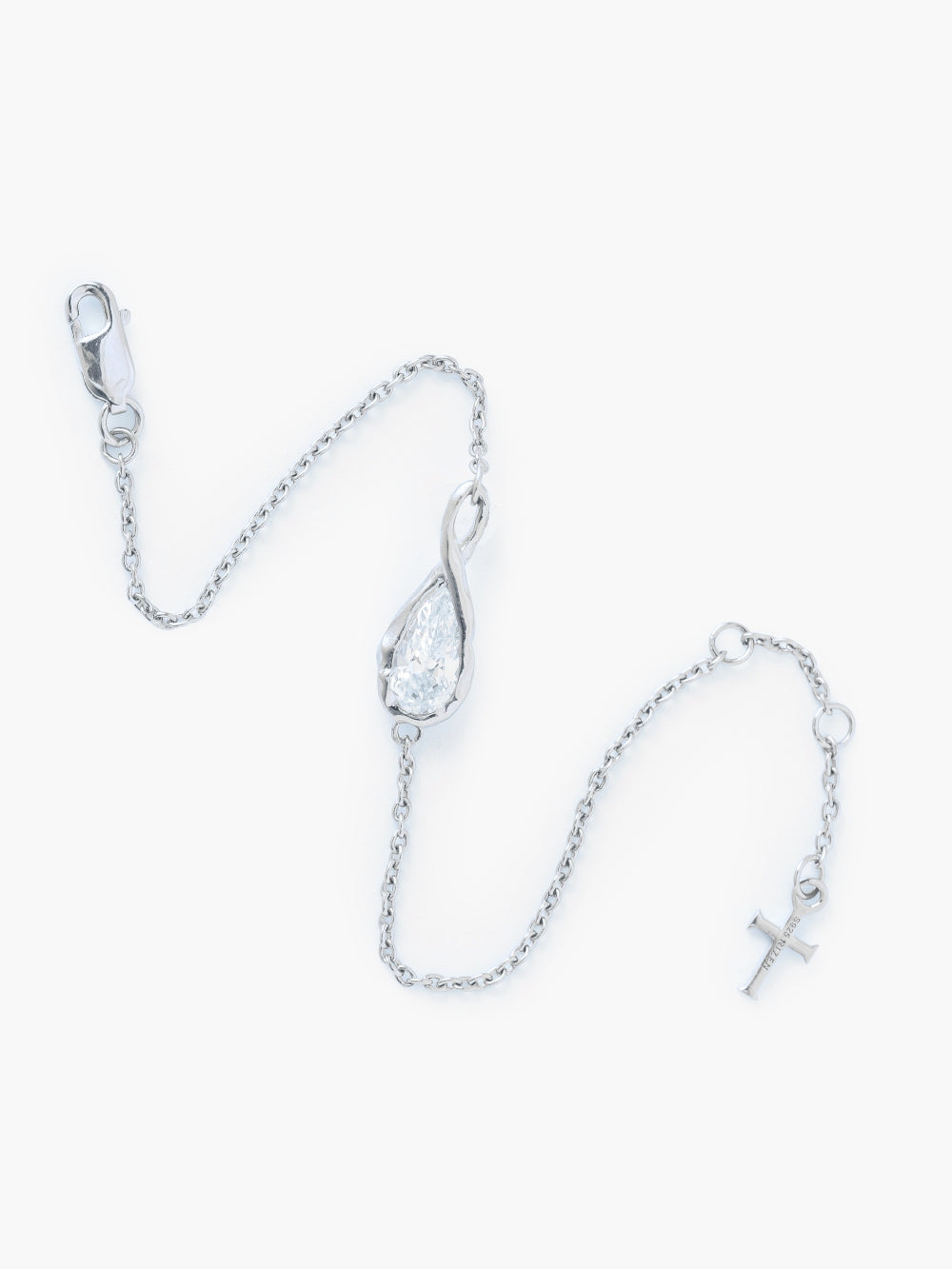 Rizen Jewelry Solace Teardrop Bracelet is a delicate silver cable chain bracelet with a teardrop infinity pendant with a teardrop shaped simulated diamond also has a lobster clasp and signature Rizen Cross Pendant Tag that is adjustable to three different lengths.  