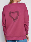 Back of LOVED sweatshirt featuring Crown of Thorns Heart embroidery with LOVED sentiment.