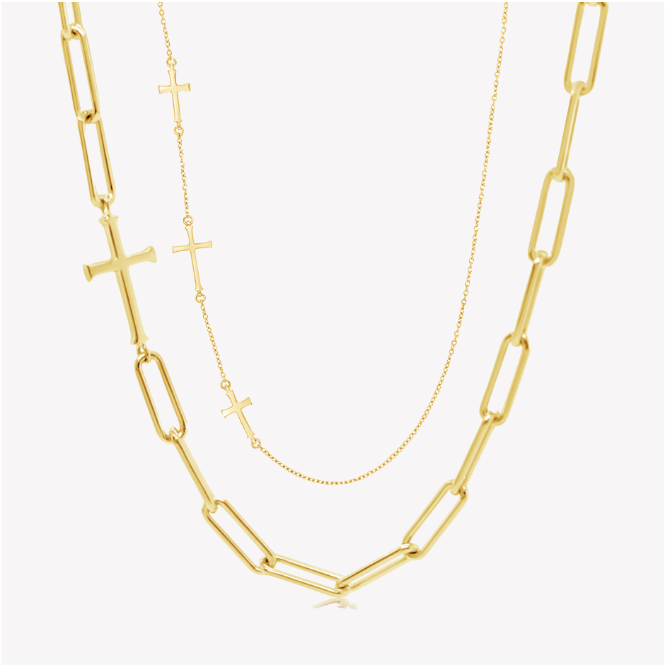Close up of the chain breaker and calvary cross station necklaces in gold vermeil from the calvary collection by Rizen Jewelry