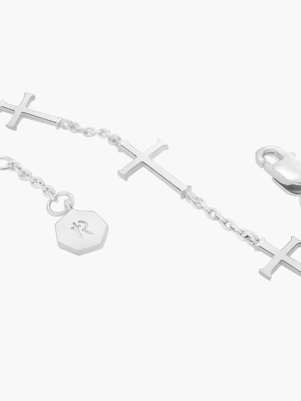 Up close detail of the Calvary cross bracelet in sterling silver from the Calvary collection.  A timeless baptism gift by Rizen Jewelry.