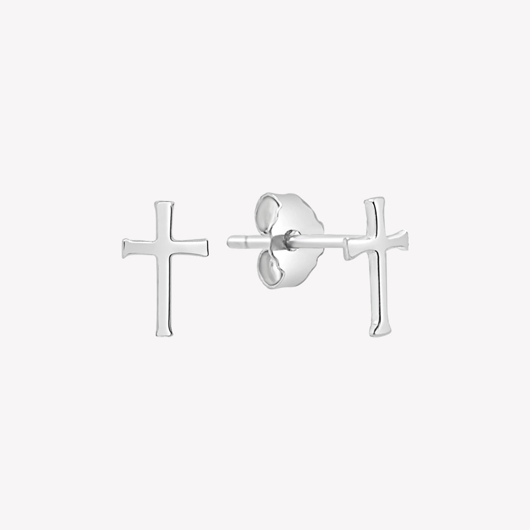 Close up of sterling silver mini Cross Earrings from the Calvary Collection by Rizen Jewelry.