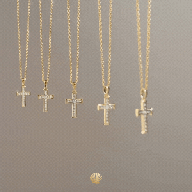 18k gold vermeil luminous cross pendant necklace featuring 12 sparkling cubic zirconia channel set on an adjustable 20" cable chain by Rizen Jewelry catching the light. 