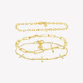 A three-piece 18k gold-plated cross bracelet set featuring a Calvary cross bracelet and two additional chain breaker cross bracelets from Rizen Jewelry. 