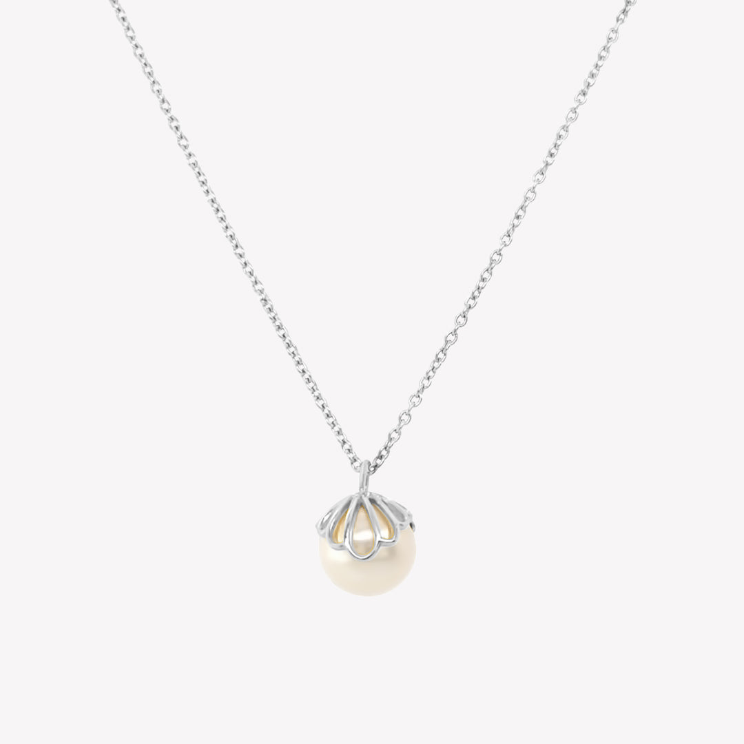 Rizen Jewelry shell encased pearl necklace in sterling silver from the Becoming Collection.